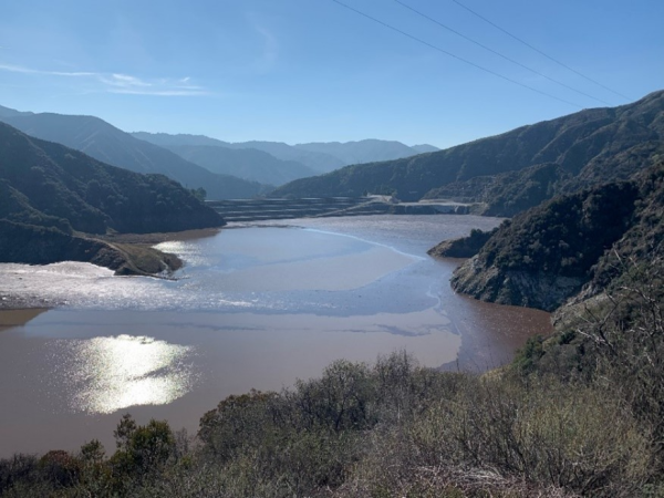 Strong storms brought tons of sediment and debris into the San Gabriel Reservoir during the winter after the 2024 Bridge Fire.