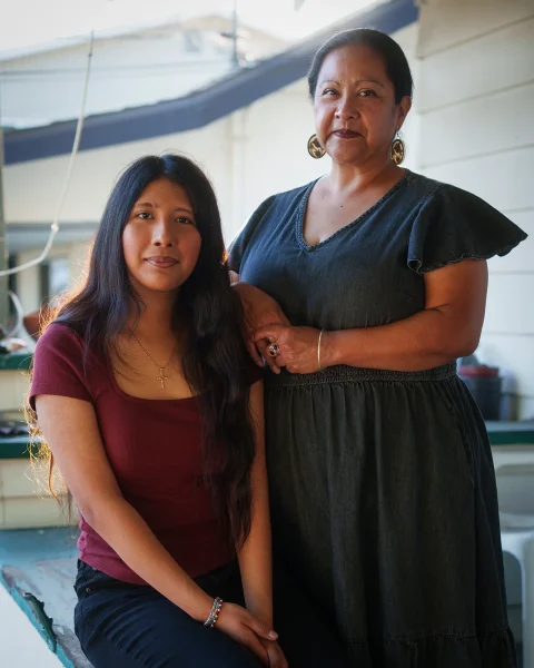 At left, Lily Montana sits next to her mom, Celestina Castillo, on their porch in Los Angeles on May 7.