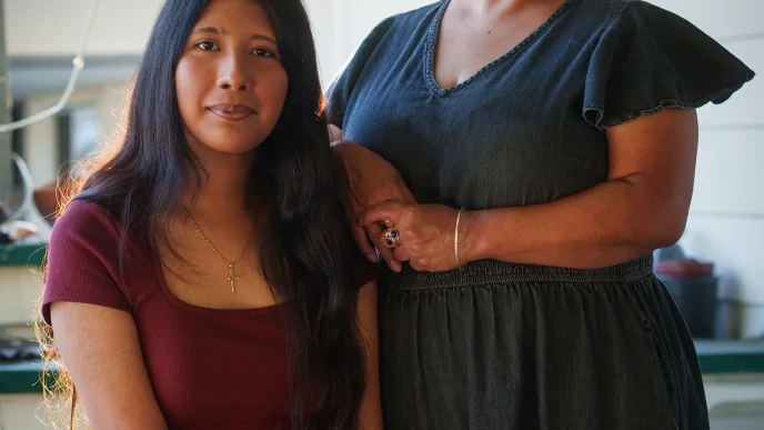 At left, Lily Montana sits next to her mom, Celestina Castillo, on their porch in Los Angeles on May 7.
