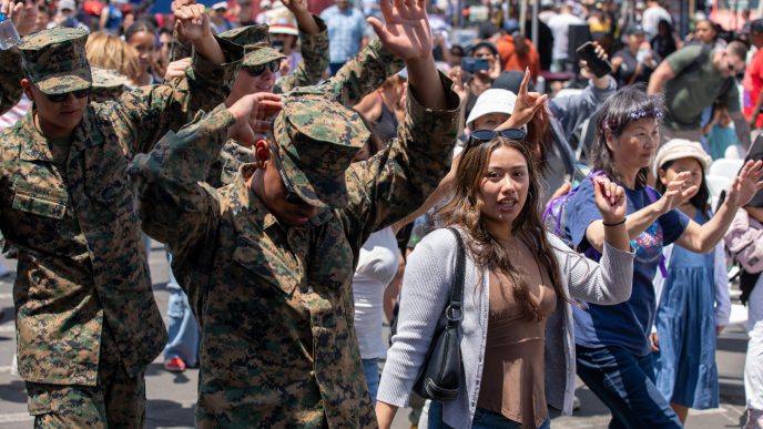 U.S. Marines dance with civilians as part of Los Angeles Fleet Week in 2025.