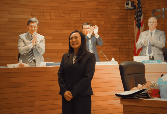 Eileen Wang accepts the title of mayor Feb. 3, 2026, as City Councilmen David Fu, at left, Michael Cao and Public Works Director Paul Cranmer applaud along with the other meeting attendees.
