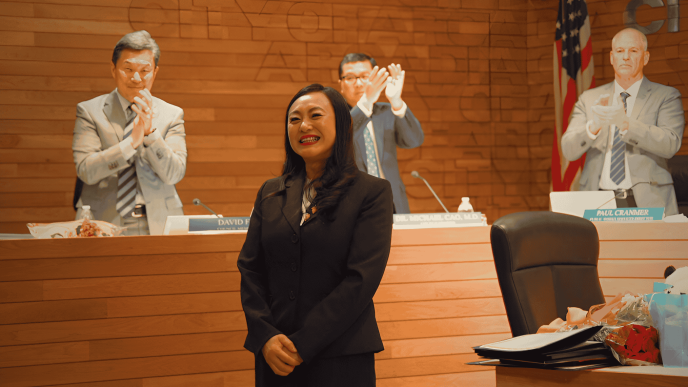 Eileen Wang accepts the title of mayor Feb. 3, 2026, as City Councilmen David Fu, at left, Michael Cao and Public Works Director Paul Cranmer applaud along with the other meeting attendees.