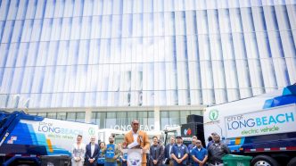 Mayor Rex Richardson joins other Long Beach officials and community members to unveil the city's first electric garbage collection trucks.