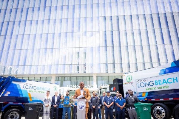 Mayor Rex Richardson joins other Long Beach officials and community members to unveil the city's first electric garbage collection trucks.