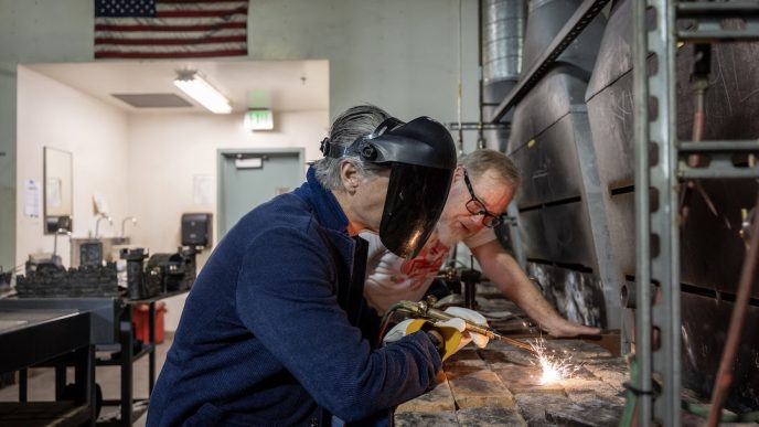 Gov. Gavin Newsom, at right, welds during his visit Friday, May 1 to Pasadena City College.