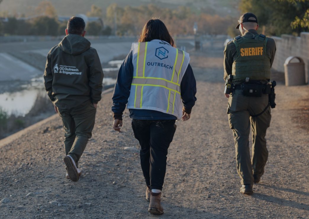Outreach workers and a sheriff's deputy participate in the 2026 Point in Time Count in Orange County.