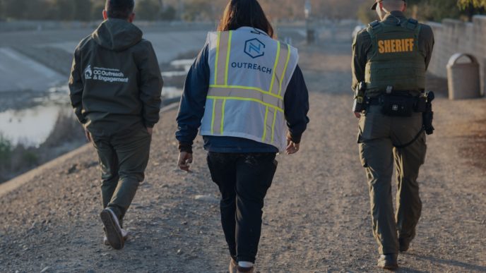 Outreach workers and a sheriff's deputy participate in the 2026 Point in Time Count in Orange County.