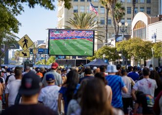 Crowds gather in downtown Long Beach to watch a global soccer match between the United States and Paraguay on June 12, 2026.