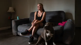 Jessica Scott, 35, and her pitbull Baby Girl inside their new apartment in Sacramento on July 1, 2026.