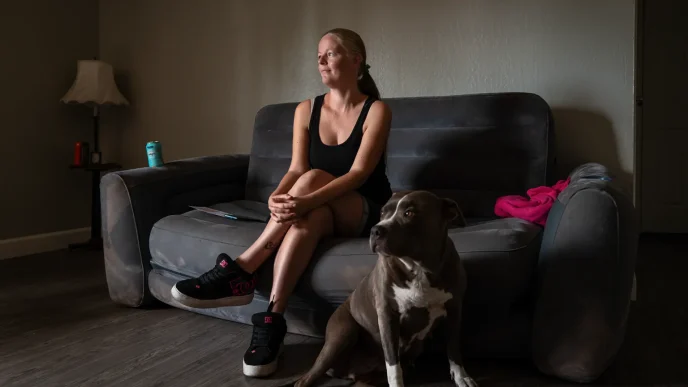Jessica Scott, 35, and her pitbull Baby Girl inside their new apartment in Sacramento on July 1, 2026.