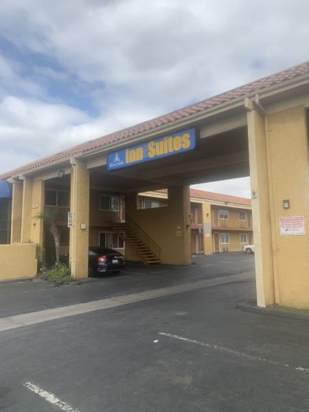 The driveway entrance to the Riverside Inn & Suites on Magnolia Avenue.