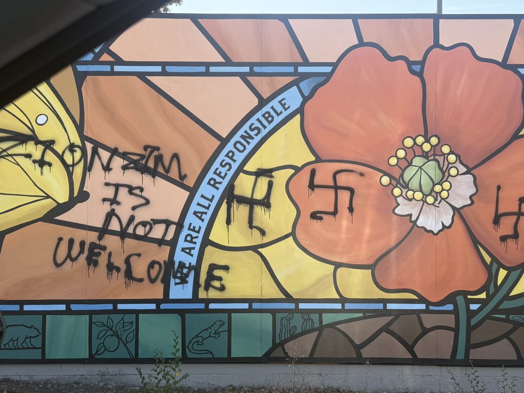 Vandals painted racist graffiti on this mural at the Pasadena Jewish Temple & Center.