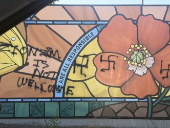 Vandals painted racist graffiti on this mural at the Pasadena Jewish Temple & Center.