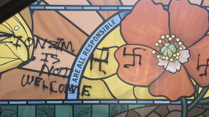 Vandals painted racist graffiti on this mural at the Pasadena Jewish Temple & Center.