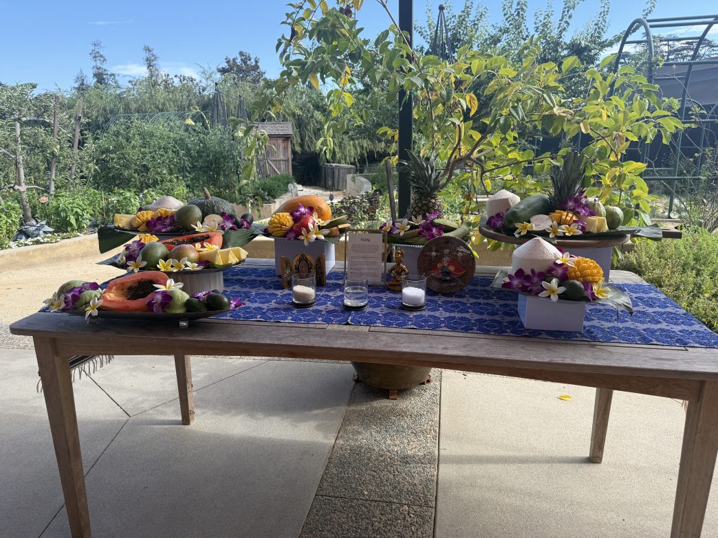 A table holds a display of atang, a food offering to ancestors.