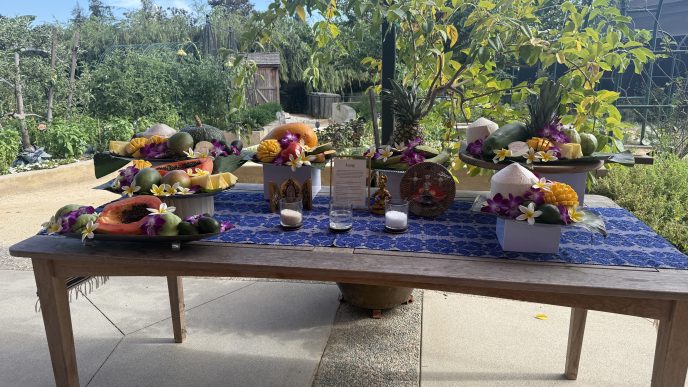 A table holds a display of atang, a food offering to ancestors.