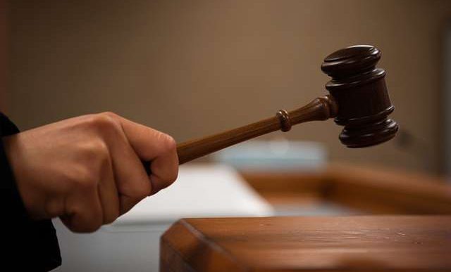 A judge bangs a gavel.