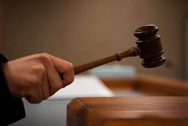 A judge bangs a gavel.