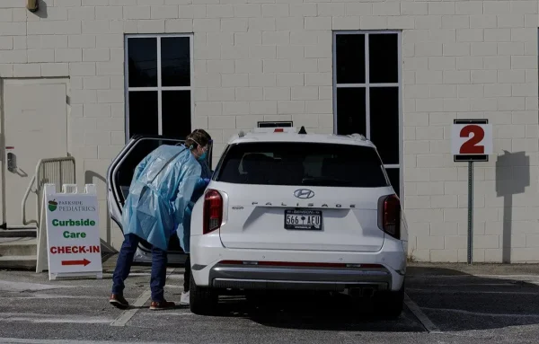 Parkside Pediatrics providers assess a patient with measles symptoms in Spartanburg, South Carolina. | Photo courtesy of Juan Diego Reyes // For The Washington Post via Getty Images/Stacker