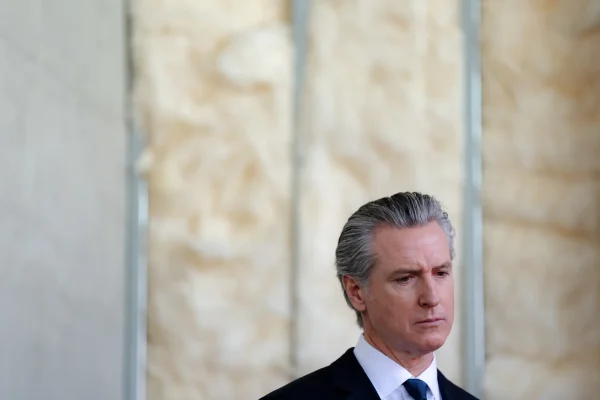 Gov. Gavin Newsom joins local officials to sign legislation intended to modernize the financing and delivery of affordable housing in California during a press conference in Oakland on July 13, 2026.
