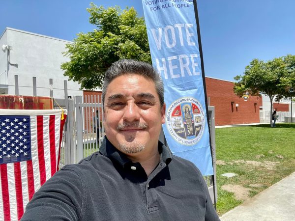 Councilman Martin Herrera campaigns in 2022.