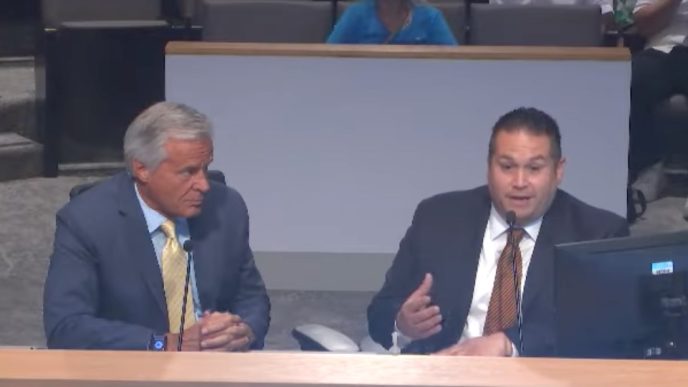 Paul Toomey, a planning manager for the county, and Planning Chief Paul Gonzales brief the Board of Supervisors last week on the proposed Lonely Dove Motel expansion.