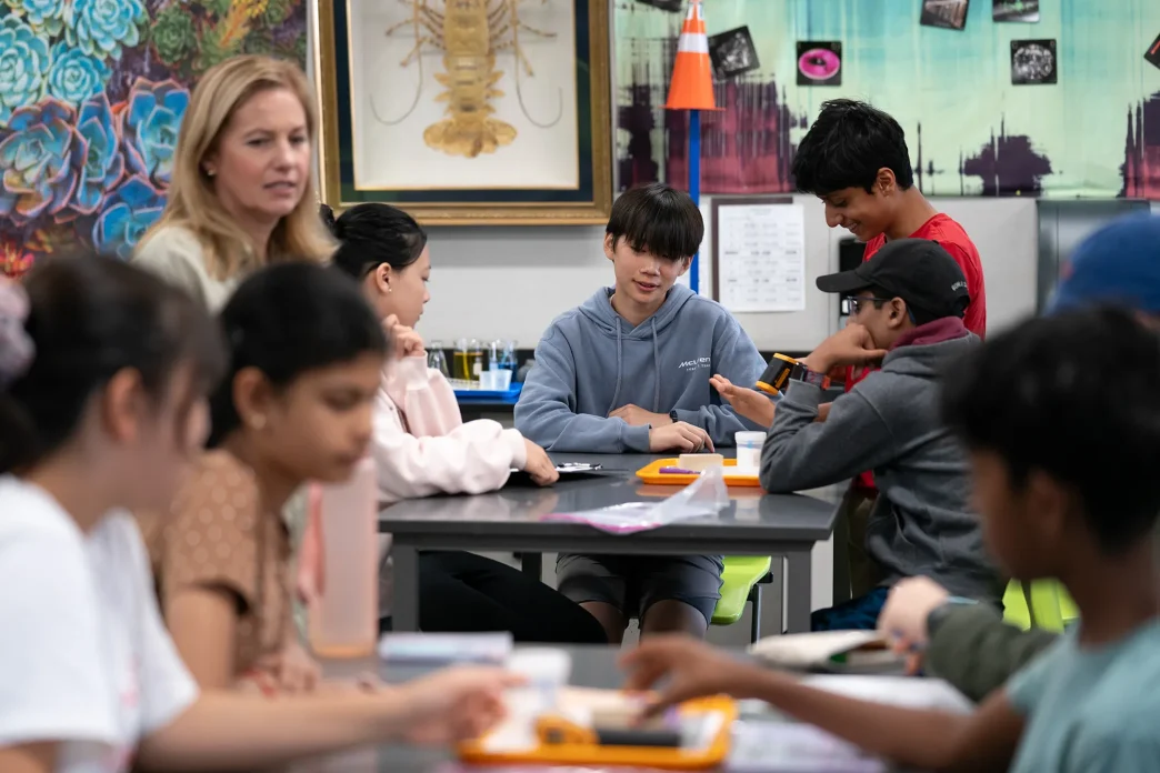 Teacher Emily Adams’ eighth-grade science class at Lawson Middle School in Cupertino on Aug. 26, 2025. Only two weeks into the school year, students are doing basic exercises to familiarize themselves with lab instruments, learn the value of accuracy, and practice working together to build a foundation for the rest of the year.