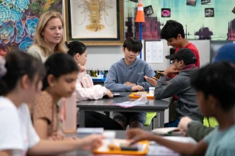 Teacher Emily Adams’ eighth-grade science class at Lawson Middle School in Cupertino on Aug. 26, 2025. Only two weeks into the school year, students are doing basic exercises to familiarize themselves with lab instruments, learn the value of accuracy, and practice working together to build a foundation for the rest of the year.