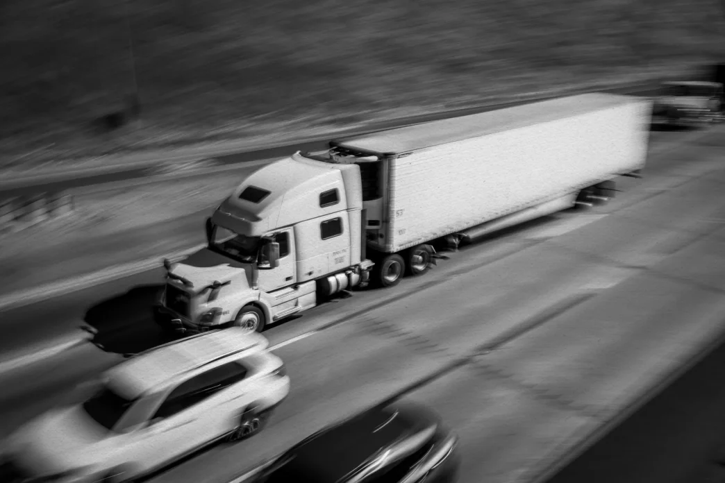 Trucks and cars drive along Interstate 580 through the Altamont Pass.