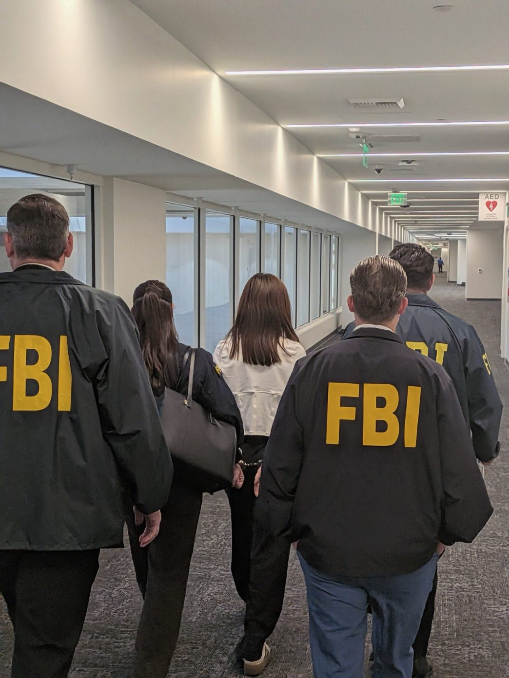 FBI agents arrest Wanying "Heather" Zhang at LAX Sunday, Oct. 5, 2026.