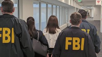 FBI agents arrest Wanying "Heather" Zhang at LAX Sunday, Oct. 5, 2026.